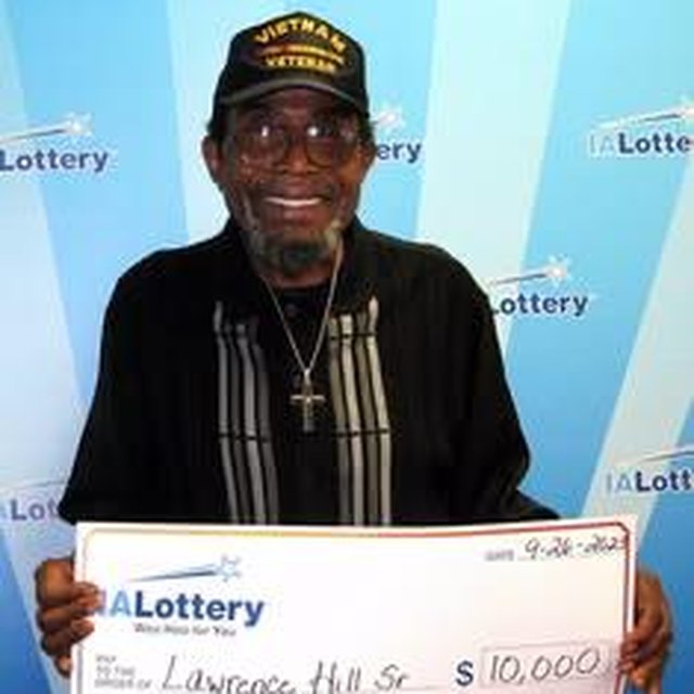 Winner holding a $10,000 check