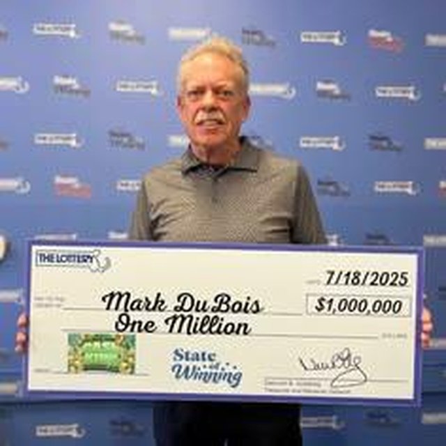 Winner holding a $1,000,000 check